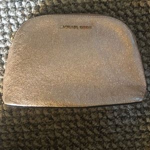Rose gold- Michael Kors’ clutch